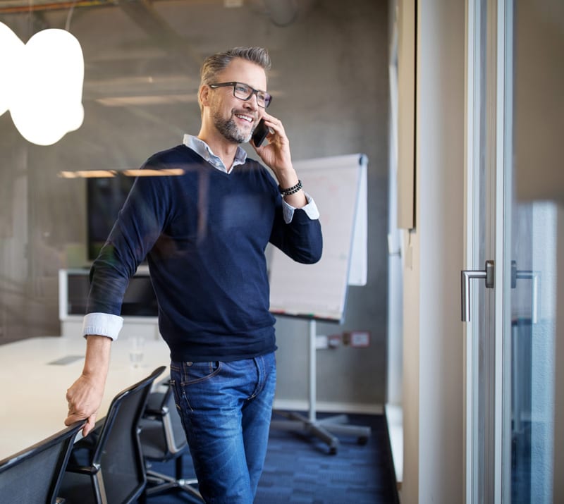 Law Office of Tipton-Downie | Attorney at Law | Vidalia, GA | man on phone in office